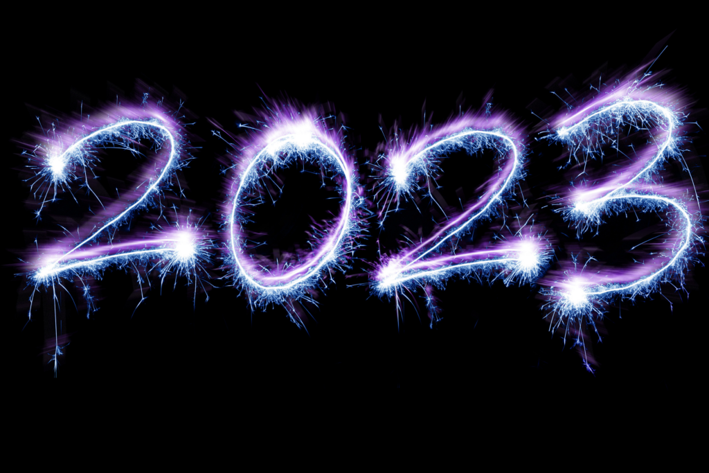 Blue purple sparkling fireworks as happy new year holiday 2023 over black background
